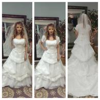 Bridal gown with full skirt and removeable capped sleeves