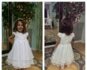 An Adorable white flower girl dress.