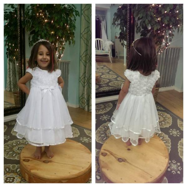 An Adorable white flower girl dress.