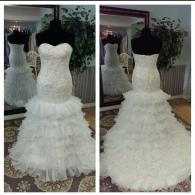 Wedding gown with ruffled skirt