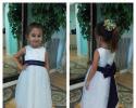 Find your little lady's flower girl dress at Lovie's Recycled Weddings. This adorable dress is complete with rose tulle and royal blue bow to match the bridesmaid's dress. (Size 2t)