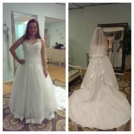 Wedding gown with lace bodice and full train